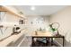 Home office space with open shelving, desk, chair, decor, and natural lighting at 3123 N Elizabeth St, Denver, CO 80205