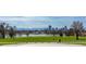 Skyline view overlooking green park space, city buildings, and mountains at 3123 N Elizabeth St, Denver, CO 80205