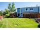 Expansive backyard featuring a lush lawn and privacy fence, perfect for outdoor activities at 7933 Chase Cir # 182, Arvada, CO 80003