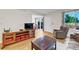 Inviting living space with wood floors and seamless access to the dining area and backyard at 7933 Chase Cir # 182, Arvada, CO 80003