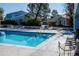 A large swimming pool is surrounded by lounge chairs, offering a relaxing space for residents and guests to enjoy at 7933 Chase Cir # 182, Arvada, CO 80003