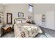 Cozy bedroom with a decorative bed frame, ample lighting, and neutral tones at 1230 E 130Th Ave # D, Thornton, CO 80241