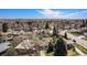 Expansive aerial view showcases the neighborhood's layout and the surrounding lush greenery at 1580 S Krameria St, Denver, CO 80224