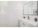 Simple white bathroom with stylish square mirror and modern faucet at 1580 S Krameria St, Denver, CO 80224