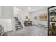 Welcoming entryway with staircase, desk, and modern decor at 1580 S Krameria St, Denver, CO 80224