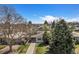 Charming single-story home with mature trees, a long driveway, and carport at 1580 S Krameria St, Denver, CO 80224