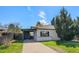 Charming home with a well-maintained front yard and driveway with easy street access at 1580 S Krameria St, Denver, CO 80224