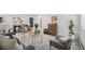 Comfortable living room with neutral walls, large rug, and plenty of seating for Gathering and guests at 1580 S Krameria St, Denver, CO 80224