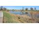 Scenic view of pond with natural grass edge, and the calm water reflecting the blue sky at 1580 S Krameria St, Denver, CO 80224