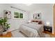 Comfortable bedroom with decorative wall art, sleek bedside tables, and a plush bed at 8675 Calvin Dr, Arvada, CO 80002