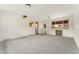 Large living area provides ample space and abundant natural light with connection to kitchen at 8675 Calvin Dr, Arvada, CO 80002