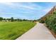 Scenic park view with lush green spaces and winding pathways provides a tranquil setting at 8675 Calvin Dr, Arvada, CO 80002