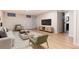Spacious finished basement with contemporary furniture, recessed lighting, and a TV, ideal for relaxation and entertainment at 2415 Pontiac St, Denver, CO 80207