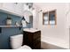 Bathroom featuring a vanity, bathtub, and a decorative plant and figurine at 2415 Pontiac St, Denver, CO 80207
