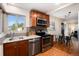 Well-lit kitchen featuring stainless steel appliances, granite countertops, and modern cabinetry at 2415 Pontiac St, Denver, CO 80207