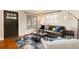 Comfortable living room showcasing a stylish sofa, a decorative rug, and plenty of natural light at 2415 Pontiac St, Denver, CO 80207