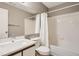 Clean bathroom featuring a shower and tub combo, white tile, and neutral wall color at 5745 W Atlantic Pl # 206, Lakewood, CO 80227