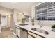 Bright kitchen featuring stainless steel appliances and an open view of the living space at 5745 W Atlantic Pl # 206, Lakewood, CO 80227