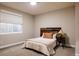Comfortable bedroom with natural light, stylish headboard, and neutral decor offers a relaxing retreat at 9575 E 3Rd Pl, Denver, CO 80230