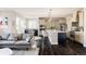 Modern kitchen with a large island, stainless steel appliances, and ample cabinet space at 9575 E 3Rd Pl, Denver, CO 80230