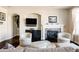Inviting living room showcasing a fireplace, dark wood floors, and an open layout at 9575 E 3Rd Pl, Denver, CO 80230