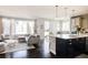Open-concept living room flowing into the kitchen, perfect for entertaining at 9575 E 3Rd Pl, Denver, CO 80230