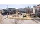Neighborhood street view, showcasing well-maintained homes and common green areas at 9575 E 3Rd Pl, Denver, CO 80230