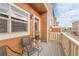 Charming balcony showcases a cozy seating area, perfect for enjoying the outdoors and the surrounding neighborhood views at 18061 E Saskatoon Pl, Parker, CO 80134