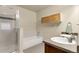 Bright bathroom featuring a tub, shower, cabinet storage, and double vanity with sink at 18061 E Saskatoon Pl, Parker, CO 80134