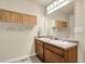 Dual sinks with cabinets and drawers offers great bathroom storage at 18061 E Saskatoon Pl, Parker, CO 80134