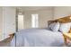 Comfortable bedroom showcasing a cozy bed, soft lighting, and a glimpse into the adjacent bathroom adding convenience and style at 18061 E Saskatoon Pl, Parker, CO 80134