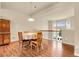 Bright dining room features a wood table with seating for four and decorative wood hutch at 18061 E Saskatoon Pl, Parker, CO 80134