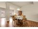 Cozy dining area featuring wood floors, a classic table set, and ample natural light at 18061 E Saskatoon Pl, Parker, CO 80134