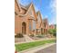 Charming townhomes with well-manicured lawns and gardens, creating a welcoming curb appeal at 18061 E Saskatoon Pl, Parker, CO 80134