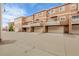 Row of brown townhomes with garages at 18061 E Saskatoon Pl, Parker, CO 80134