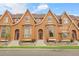 Attractive townhome featuring a unique facade, well-maintained landscaping and inviting entrance steps at 18061 E Saskatoon Pl, Parker, CO 80134