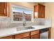 Kitchen sink under a window provides natural light and community views at 18061 E Saskatoon Pl, Parker, CO 80134