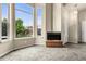 Inviting living room boasting tall windows for natural light and a cozy carpeted floor at 18061 E Saskatoon Pl, Parker, CO 80134