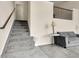 Bright living space boasts a staircase, carpet, and ample seating for relaxing and entertaining at 18061 E Saskatoon Pl, Parker, CO 80134