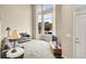 Bright living room with a large window, a cozy carpet, and comfortable seating at 18061 E Saskatoon Pl, Parker, CO 80134