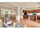 Open-concept living space with dining area, kitchen with island, and comfortable seating at 18061 E Saskatoon Pl, Parker, CO 80134