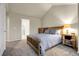 Inviting main bedroom featuring soft carpet, a comfortable bed, and ample natural light, creating a peaceful retreat at 18061 E Saskatoon Pl, Parker, CO 80134