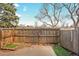 Fenced backyard area with a patio, offering privacy and a small patch of artificial turf at 8019 Wolff # G, Westminster, CO 80031