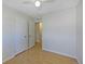 Bright bedroom with access to hallway, featuring wood-look floors and neutral walls at 8019 Wolff # G, Westminster, CO 80031