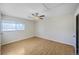 Bright bedroom with neutral walls, wood floors, ceiling fan, and a sunlit window at 8019 Wolff # G, Westminster, CO 80031
