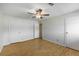 This bedroom features a ceiling fan and multiple closets for ample storage at 8019 Wolff # G, Westminster, CO 80031