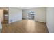 Inviting living area with wood flooring, access to the backyard, and a view of the laundry room at 8019 Wolff # G, Westminster, CO 80031