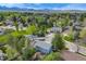 Overhead view of a neighborhood showcasing a mix of homes and mature trees, highlighting the residential landscape at 9926 W Nova Pl, Littleton, CO 80127