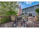 Cozy back deck with outdoor seating and umbrella, ideal for enjoying the outdoors at 9926 W Nova Pl, Littleton, CO 80127