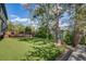 Backyard with a large lawn and a deck, perfect for relaxing and entertaining at 9926 W Nova Pl, Littleton, CO 80127